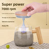 A hand is stirring a dark liquid in a glass mug with a wooden handle, demonstrating the super power 7000 rpm self-stirring fu