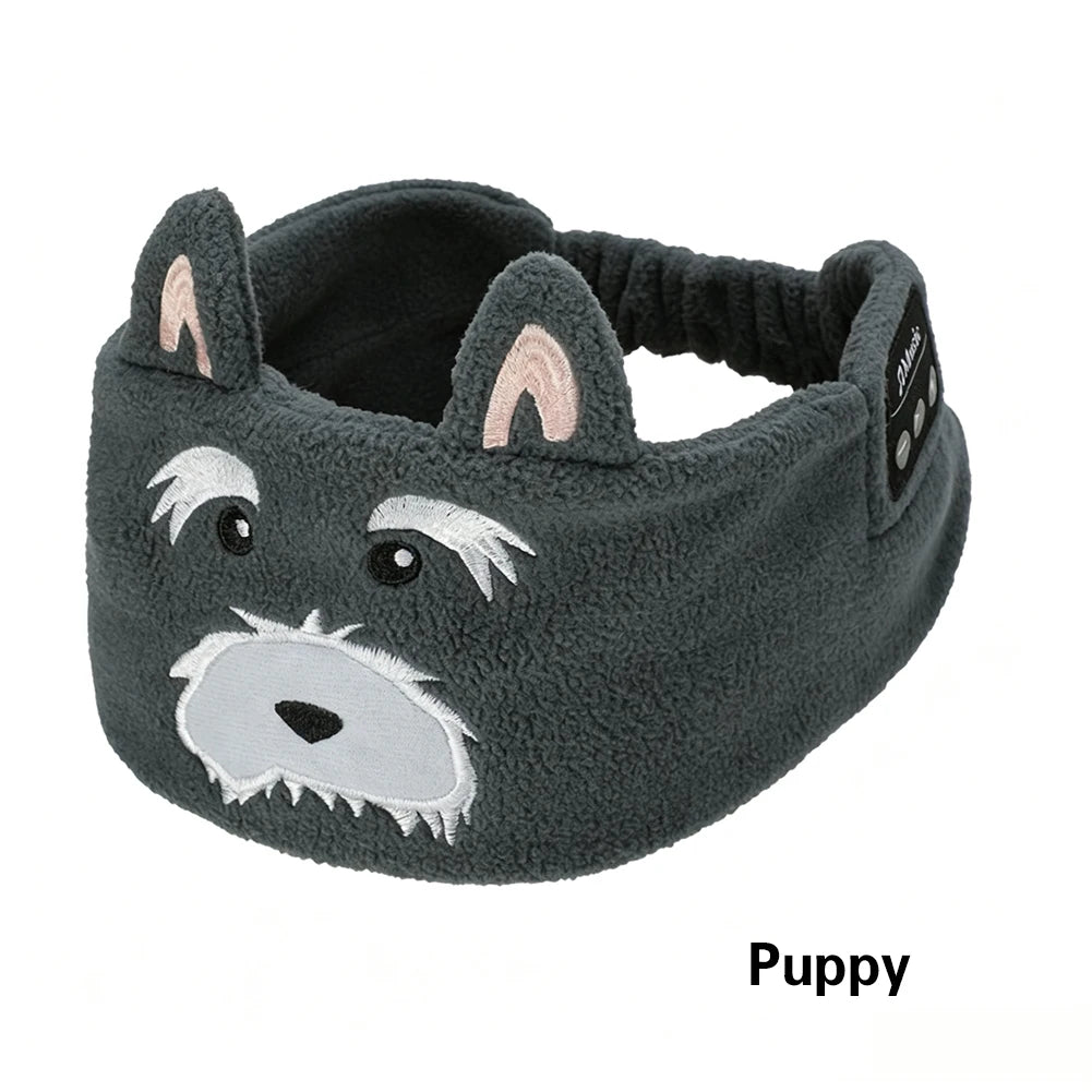 A gray felted puppy headband with white facial features and pink inner ears.