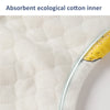 Close-up of a white absorbent ecological cotton inner lining with a yellow trim.