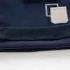 Navy fleece pullover sweatshirt with a light gray pocket detail and ribbed collar.