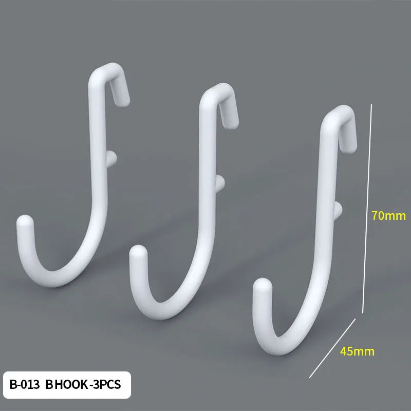 Three white hook shaped wall pegs shown against a gray background with dimension lines.