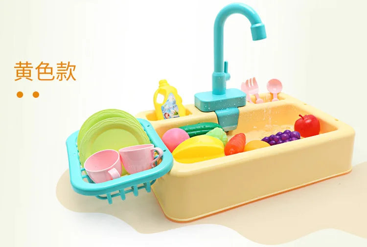 A yellow pretend play kitchen sink set with a blue faucet and various colorful plastic food items.