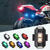 Sju färgglada mini USB laddningsbara strobe-lampor för motorcyklar och drönare.