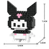 A black and white micro building block figurine of a dog with pink accents.