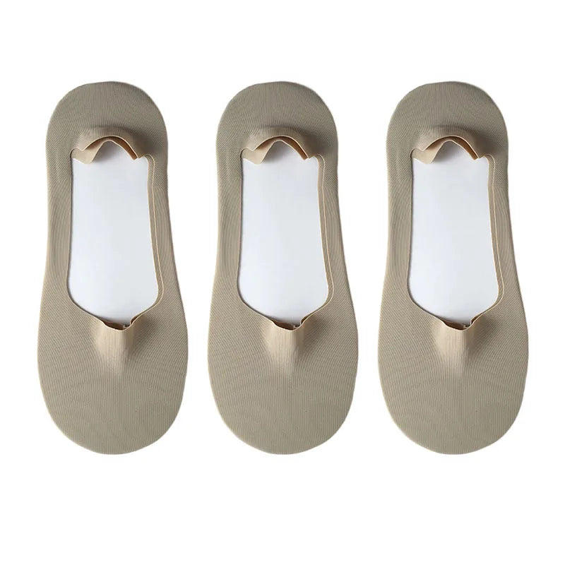 Three pairs of beige silicone grip no-show socks displayed side by side.