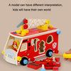 A wooden pretend play tool set showing a red fire station or police station vehicle and various building blocks.