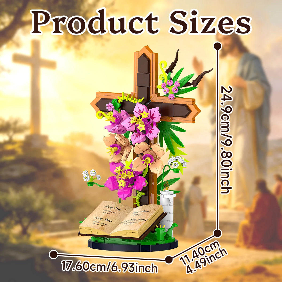 A wooden Jesus cross flower building set with pink and purple flowers displayed in a religious outdoor setting.