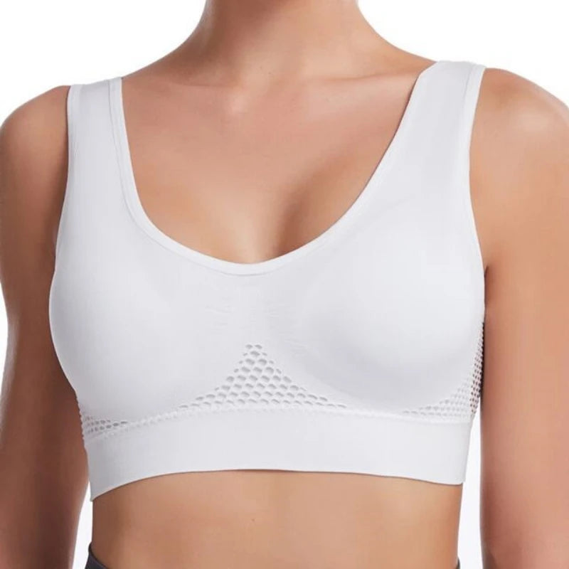 White breathable plus size sports bra with padded support shown on a model's upper body.