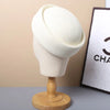 A cream-colored straw pillbox sun hat displayed on a wooden stand.
