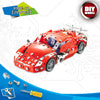 A red metal engineering vehicle building kit with detailed instructions and parts.