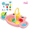 Pink kids pretend play kitchen sink set with running water featuring various food items and utensils