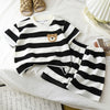 A black and white striped cotton-blend short set for kids featuring a collared tee.