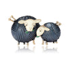 A pair of gold-toned enamel brooches shaped like sheep, featuring black textured metal and light beige faces.
