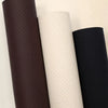Three rolls of self-adhesive PU leather repair patches in dark brown, cream, and black.