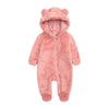 A pink fuzzy fleece hooded romper for a baby with a zipper closure.