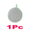 A round, light green dish sponge with a small handle is shown against a black background.
