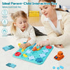 A girl and a parent interact with a colorful logical road building maze board game on a white surface.