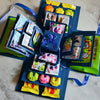 A colorful gift box kit featuring various yellow and green items, including candies and decorative elements.
