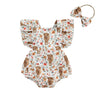 A floral and cow print baby romper with a matching fabric headband.