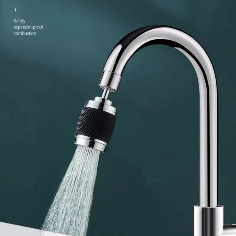 A modern chrome kitchen faucet with a spray head and a rotating adapter visible against a dark background.