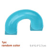 A single light blue plastic marble run piece with a curved shape and a rectangular opening.