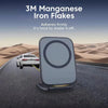 A gray magnetic iron flake phone holder is shown on a road with a white car in a desert landscape.