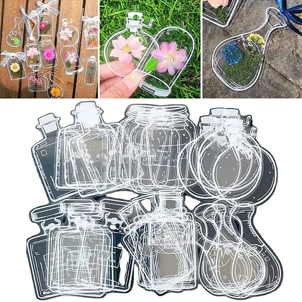 A collection of transparent glass bookmarks featuring dried flowers and various designs.
