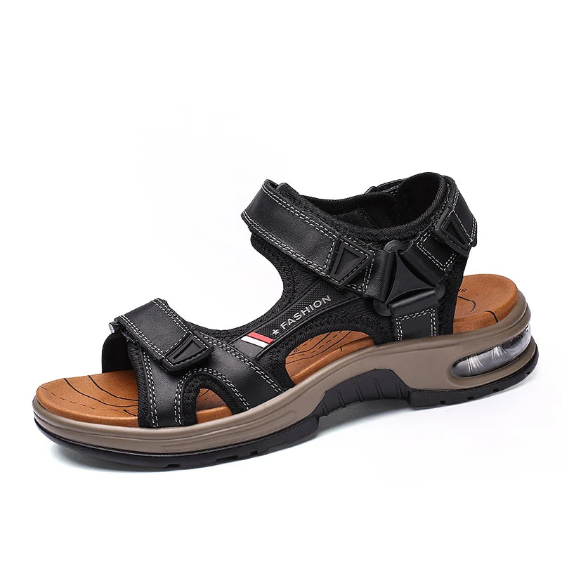A pair of black leather air cushion sandals with a tan sole and strap details.