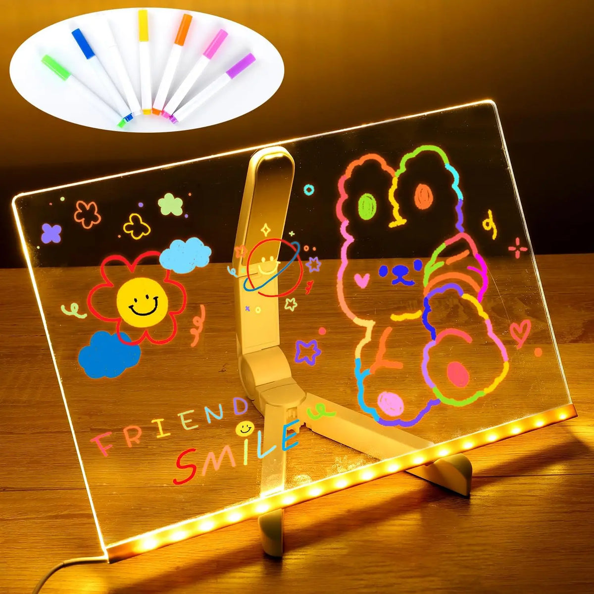 An LED glowing message board displays colorful drawings and text on a clear surface.