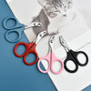 A collection of stainless steel pet nail clippers in various colors, including blue, red, pink, and black, resting on a white