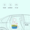 A foldable travel potty is shown inside a car, illustrating its convenience for travel and outdoor use.