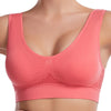 A close-up of a coral pink breathable sports bra for plus size women.