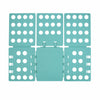 A teal clothes folding board with multiple circular holes for organizing laundry.