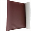 A rectangular brown leather repair patch is shown next to a roll of white self-adhesive material.
