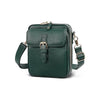 A dark green vegan leather messenger bag with a gold-toned buckle and adjustable strap.