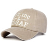 A beige letter-embroidered washed baseball cap featuring the text IDC & DGAF.