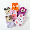 A collection of kids' cotton knee-high socks featuring various cartoon animal designs like foxes, cats, and rabbits in orange