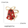 Broche navideño de campana esmaltada con pedrería dorada y lazo