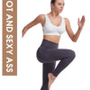 A woman models a gray sports bra and leggings, highlighting the fit of the breathable plus size athletic wear.