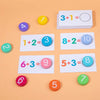 A set of wooden math cards and counting blocks showing addition problems like 3+1=4, 8+2=10, and 5+3=8.