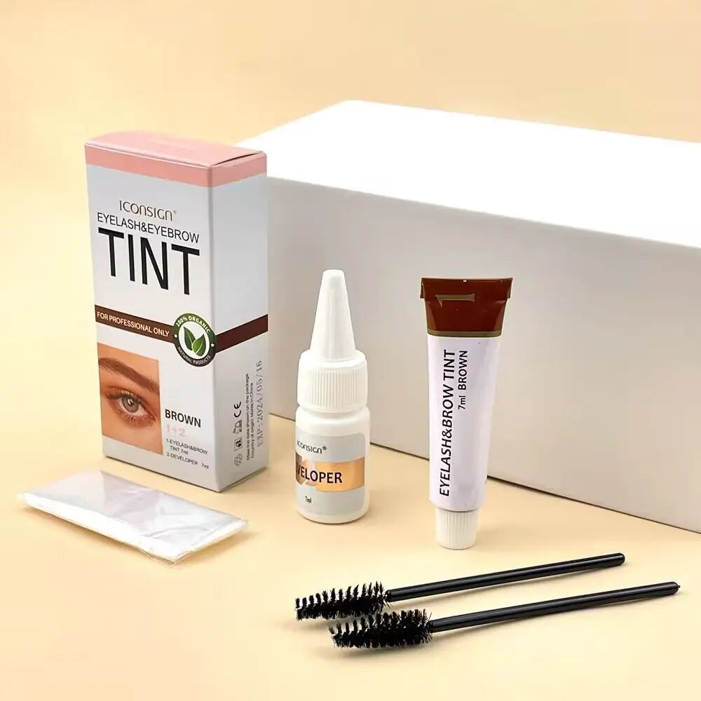 A box and applicator for an Iconsign Tint Eyebrow & Eyelash Tint kit with a brush shown on a light background.