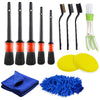 A set of various detailing brushes including flat, angled, and bristled brushes for car cleaning