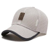 A light gray mesh baseball cap with a dark gray brim and a leather patch on the front.