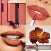 A close-up of nude brown matte lip color applied to lips, showing the texture and finish.