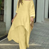 Kvinne modellerer gult bomull-lin loungesett med off-shoulder topp og vide bukser.