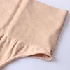 A close-up of a beige high-waist tummy control thong shaper garment.