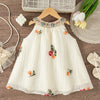 A cream-colored floral embroidered sleeveless dress for baby girls displayed on a wooden hanger.