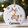 A white ceramic ornament shaped like a fawn with antlers and a red collar, featuring the name Carmen.