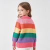 A young girl models a colorful rainbow striped knit sweater with long sleeves against a light background.