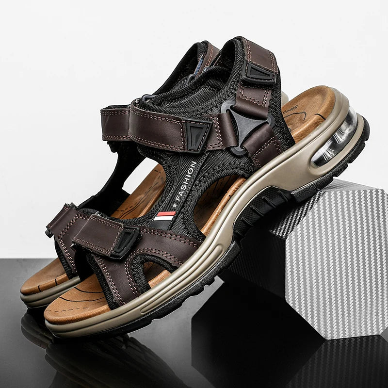 A pair of brown leather air cushion sandals with black straps resting on a dark surface.